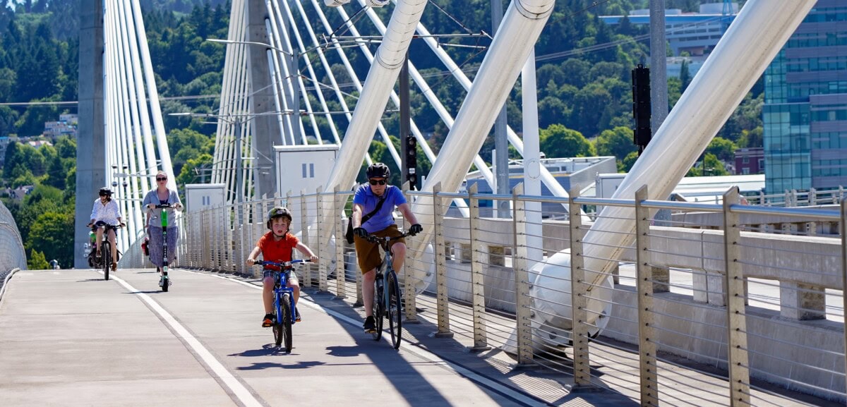 people biking across bridge downtown water front portland oregon