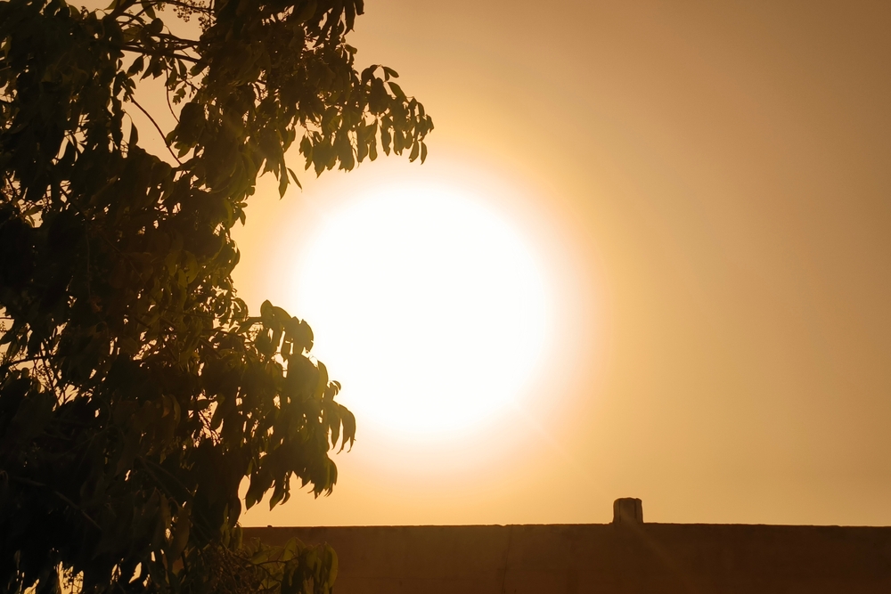 Blazing hot sun shining down during a heat wave