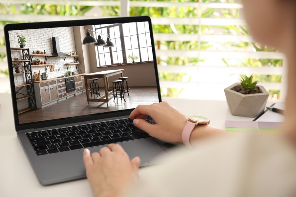 A woman looking searching for homes on her laptop.