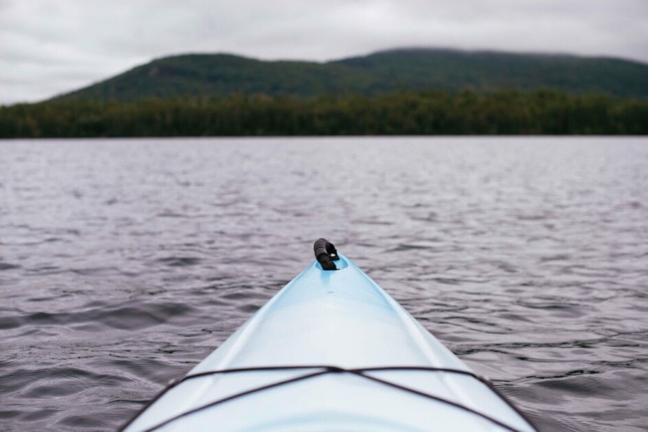 The front of a blue kayak