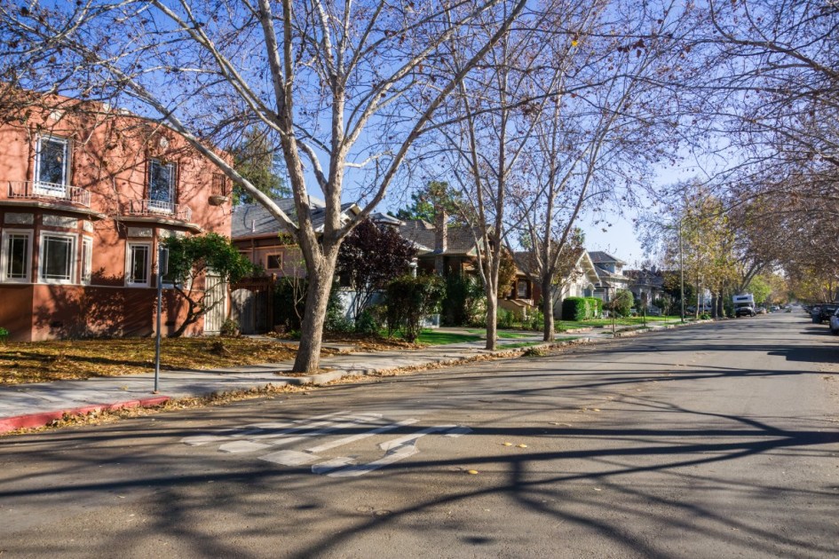 A neighborhood in the fall with bare trees.