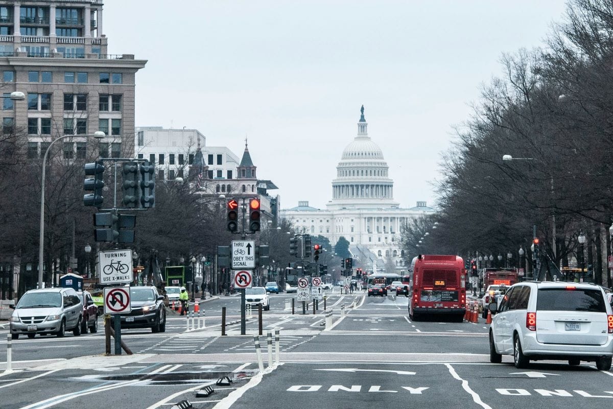 washington dc street with capitol building in the background