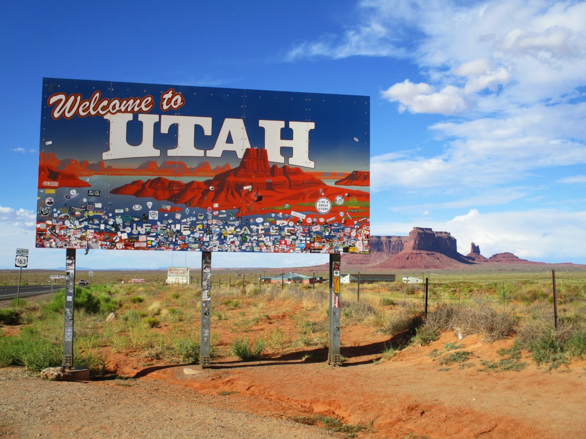 utah welcome sign along highway on sunny day